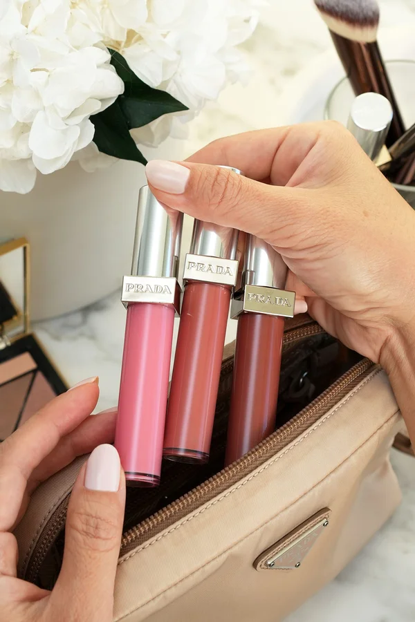 Prada Reflection Glossy Liquid Balm three shades on white background