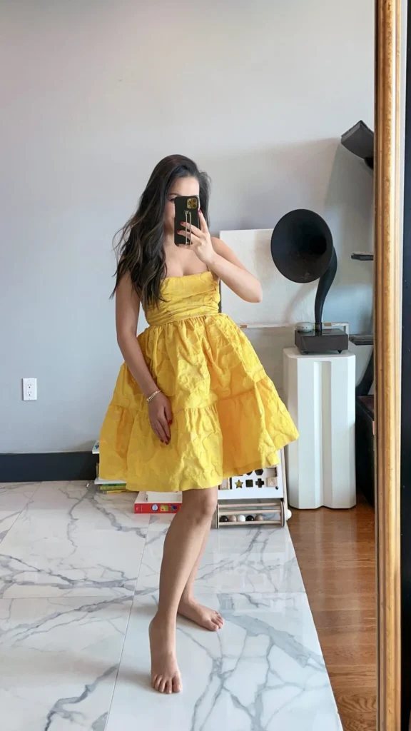 Yellow ruffled strapless dress in mirror selfie