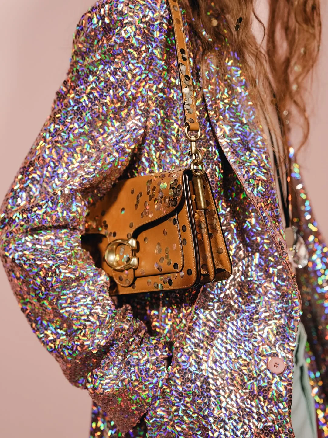 Coach Spring 2027 runway look with metallic confetti bag