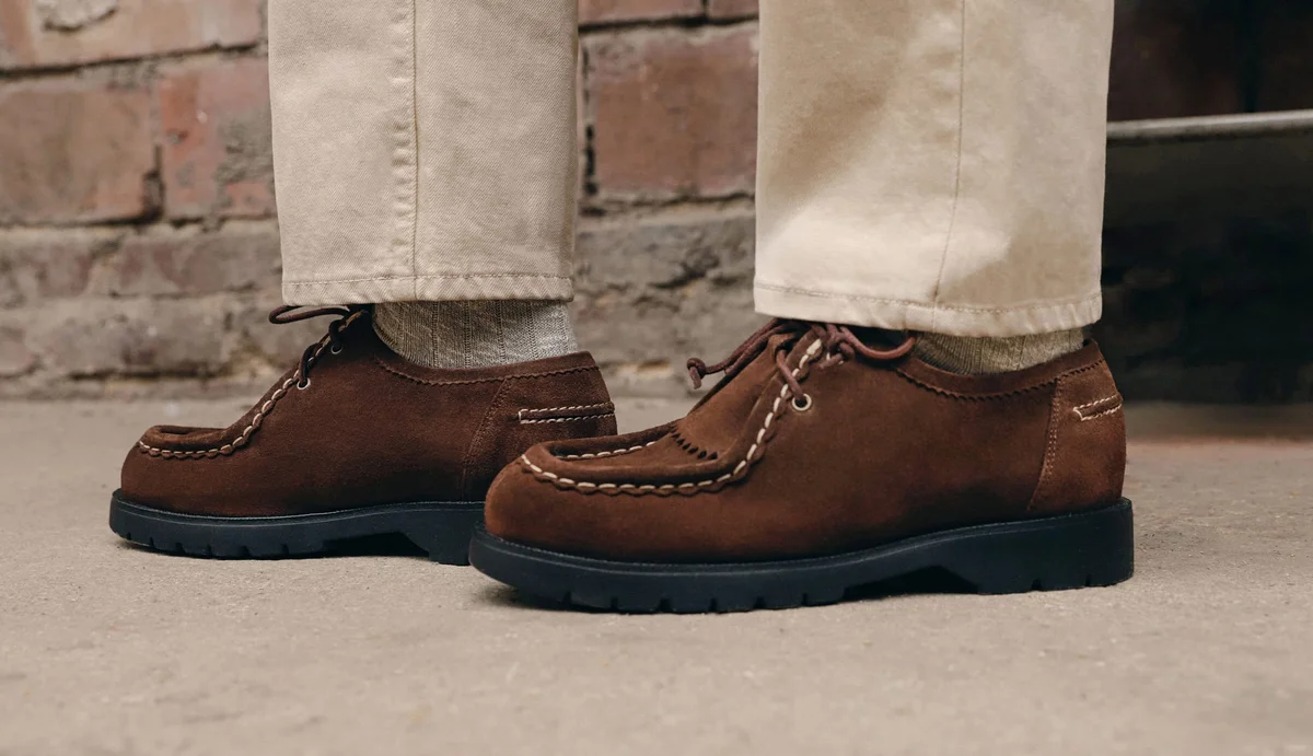 Suede desert boots with chunky lugged sole on warm street