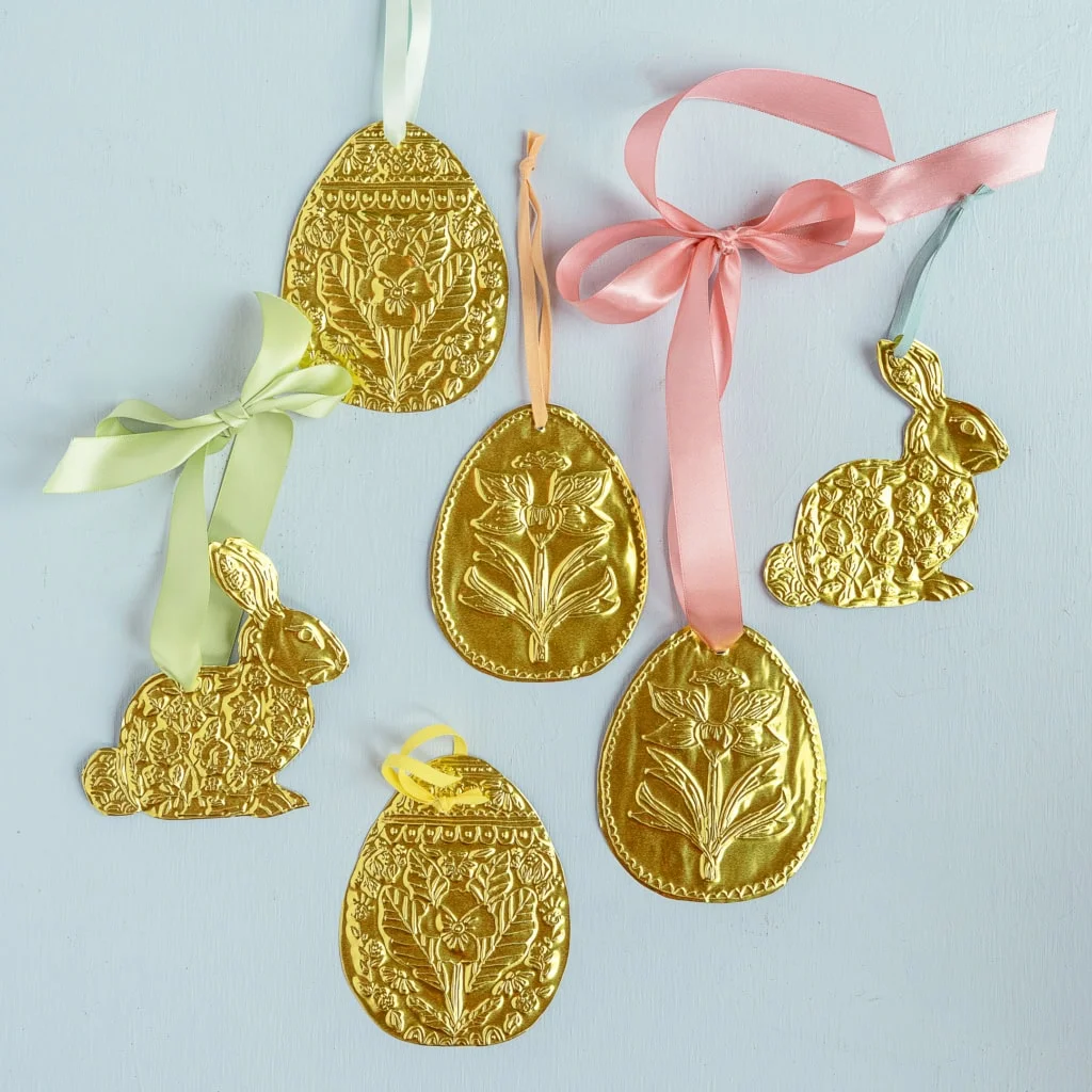 Golden tin embossed Easter ornaments with ribbon bows