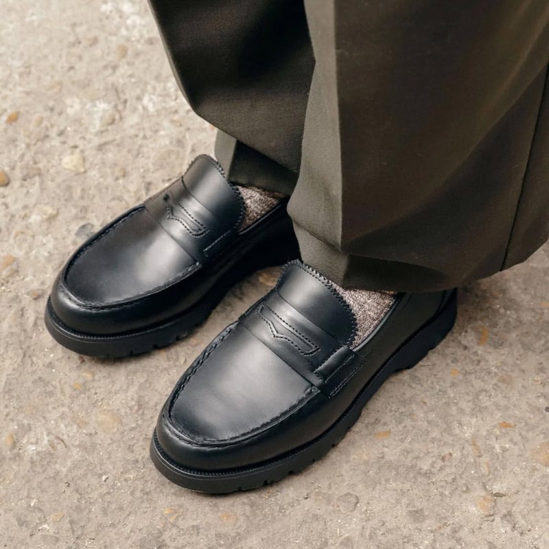 Black penny loafer with thick lugged rubber sole