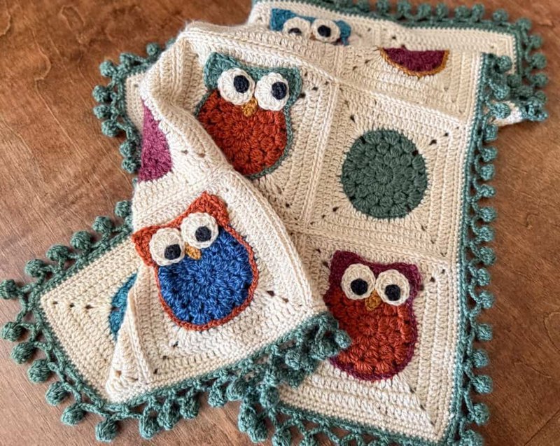 Owl afghan squares arranged in a patchwork grid layout