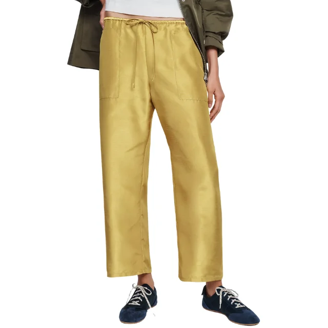 Yellow taffeta drawstring trousers styled for a fall look
